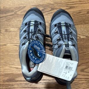 Salomon Gray and Black Athletic Shoes with Ventilated Design